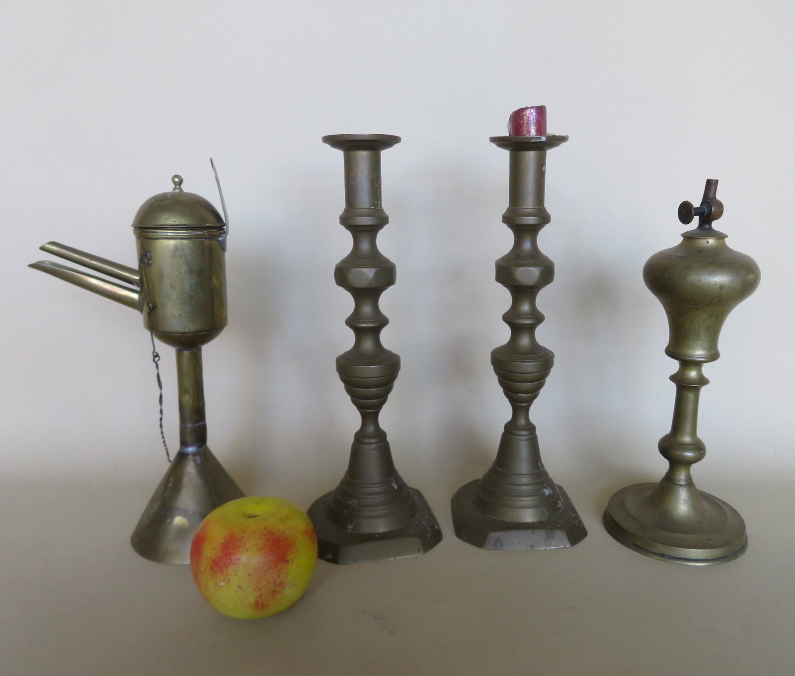 Three early brass & copper lighting devices including a: Three early brass & copper lighting devices including a brass Gardon French whale oil lamp - signed Gardon on thumb wheel - several small dings around reservoir, else very good condition - 10 5/8"H; a