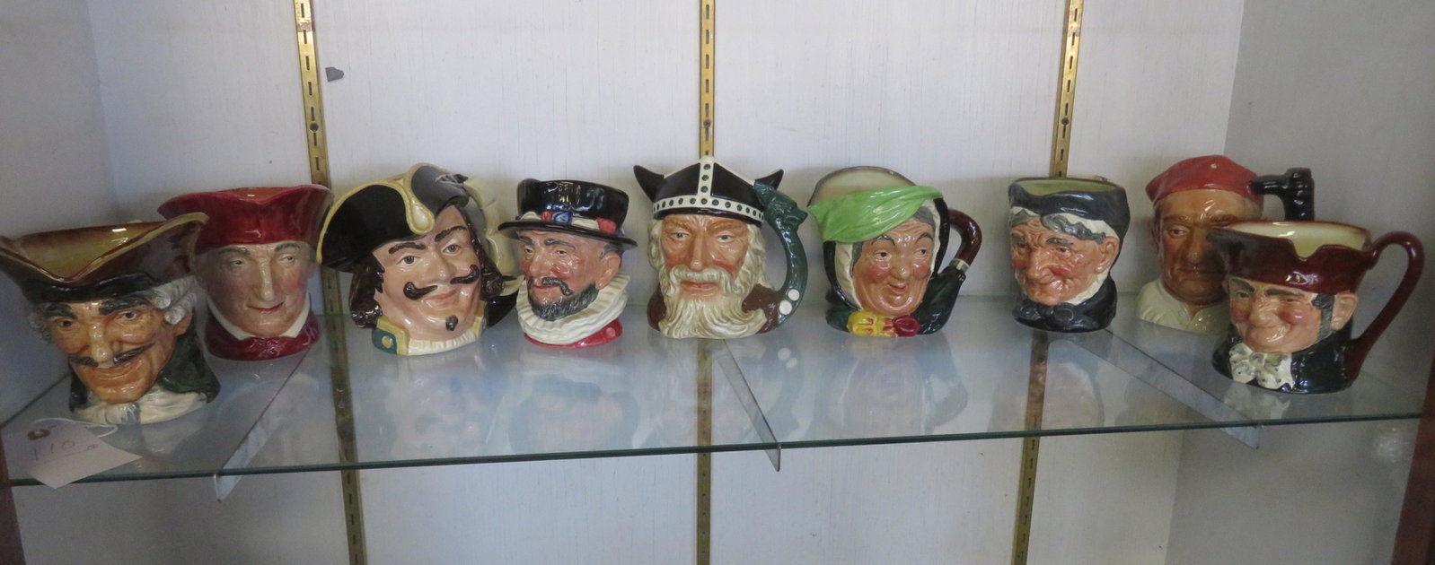 Grouping of 10 Royal Doultan toby mugs including: Old: Grouping of 10 Royal Doultan toby mugs including: Old Charlie, Boot Maker, Viking, Beefeater, Granny, Cardinal, Capt. Henry Morgan, and with no names, circa 1950 - ranging in size from 5 1/2"H to 7"H.
