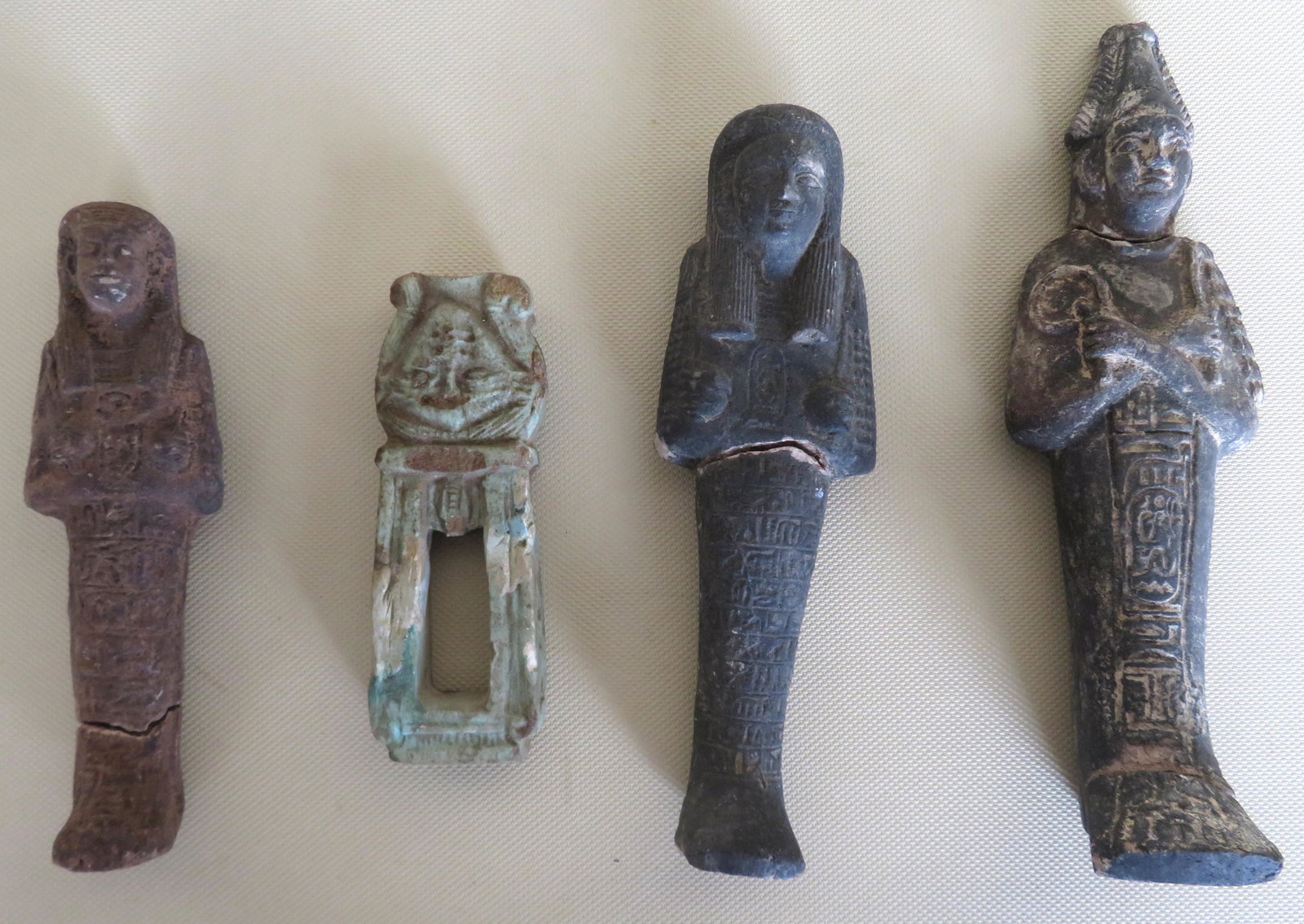 Grouping of 4 carved stone figures possibly Egyptian,: Grouping of 4 carved stone figures possibly Egyptian, all with either restoration or broken and need repairs. All are hand made and believed to be of ancient origin, but non have been authenticated by