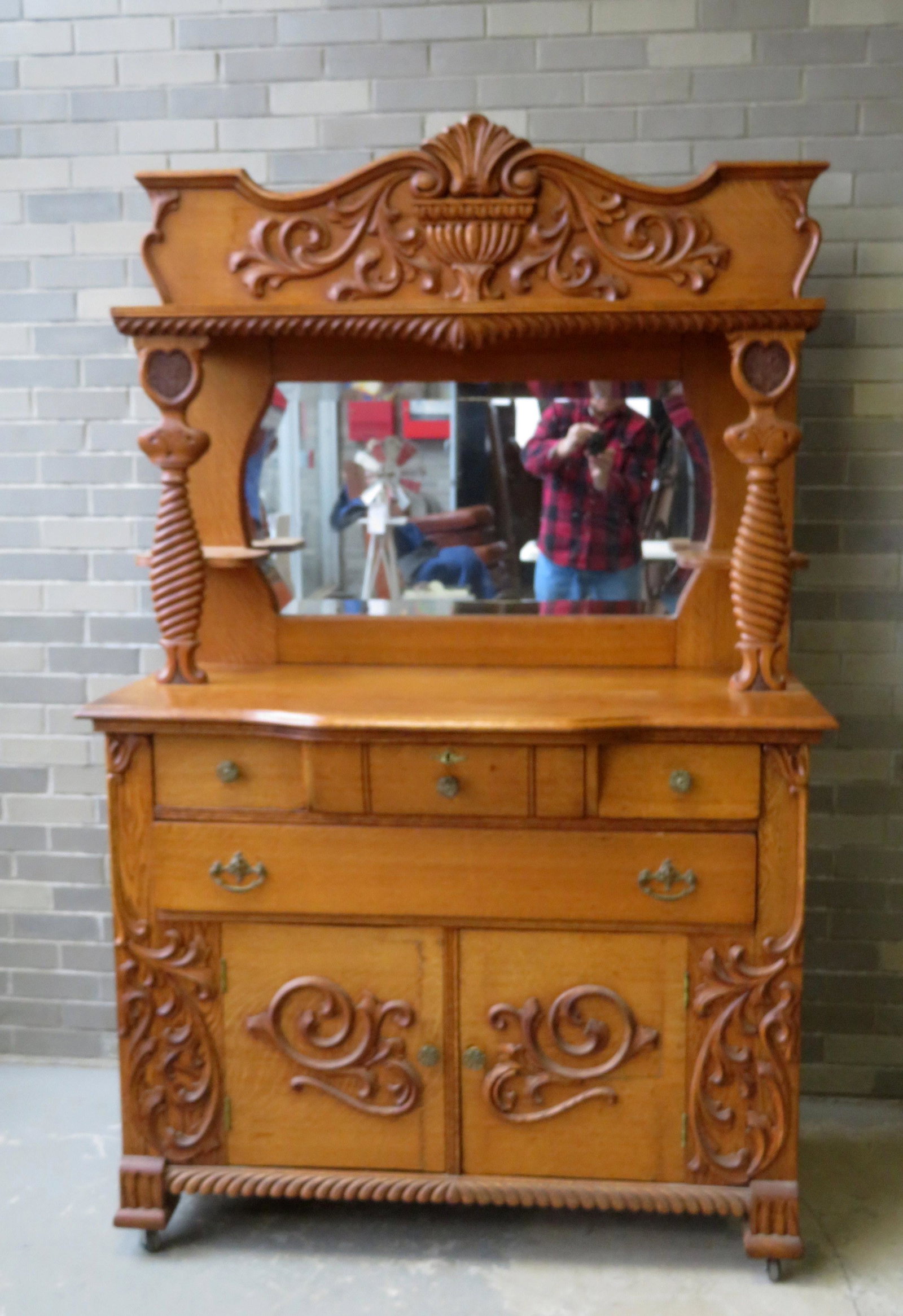 Fancy Victorian oak sideboard with mirror back and: Fancy Victorian oak sideboard with mirror back and shelves, over 3 short drawers over 1 long drawer over 2 doors - original brass hardware and original extensive applied scrolls. Note the top of the c