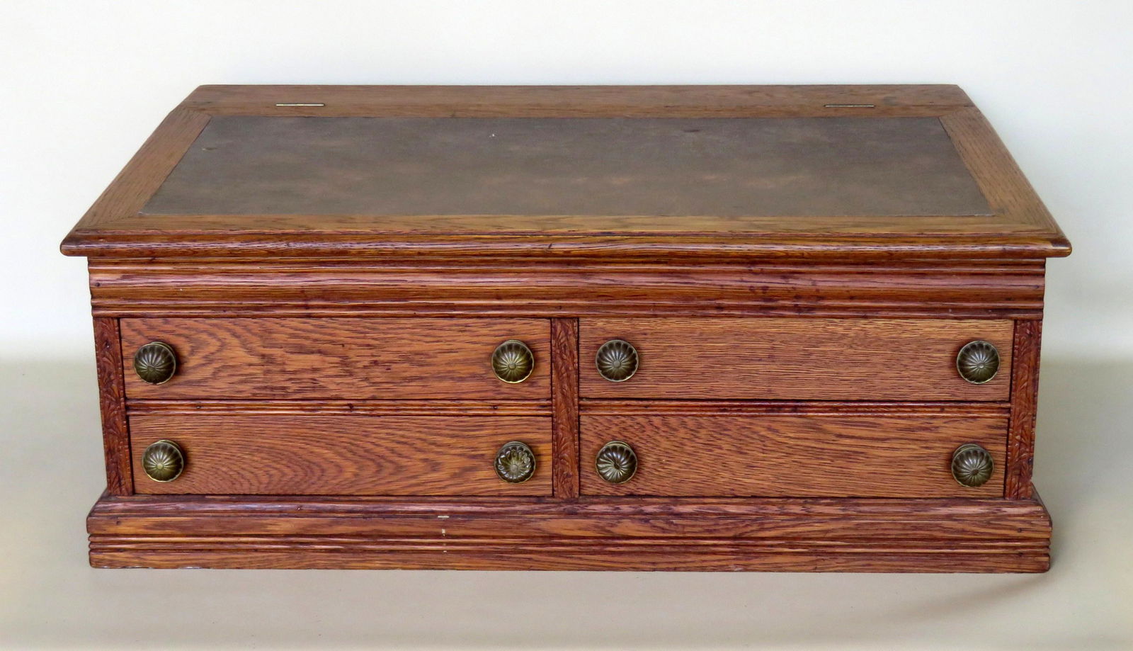 Large J & P Coats spool cabinet/desk having a slanted: Large J & P Coats spool cabinet/desk having a slanted lift top with interior storage compartment, over 4 drawers (2 side by side) with pressed brass pulls. Original paper label still attached to back