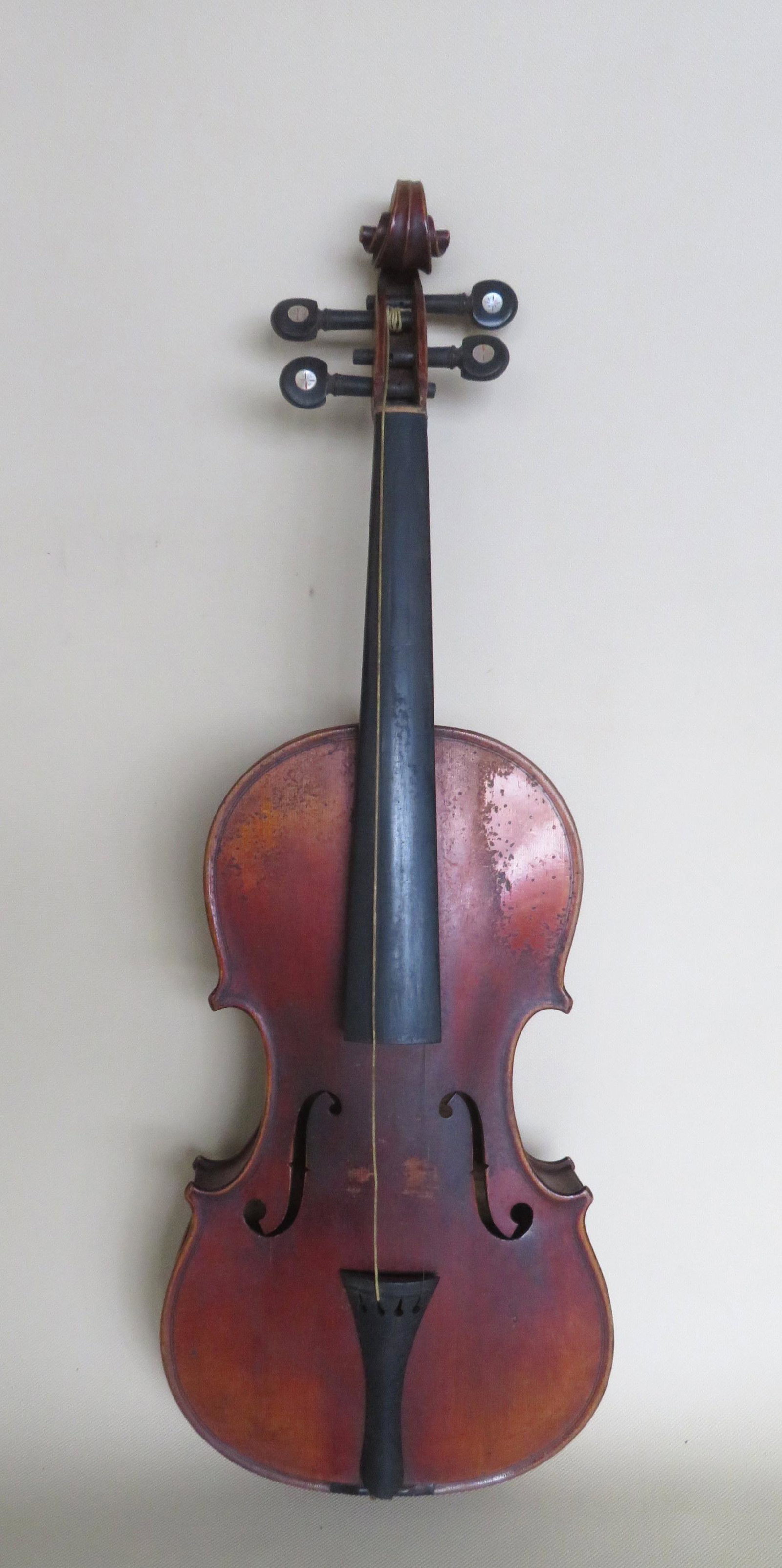 Violin in strong tiger maple having mother-of-pearl: Violin in strong tiger maple having mother-of-pearl inlaid pegs - original finish - interior Stradivarius paper label. Missing bridge and strings, but structurally sound and otherwise good condition. 