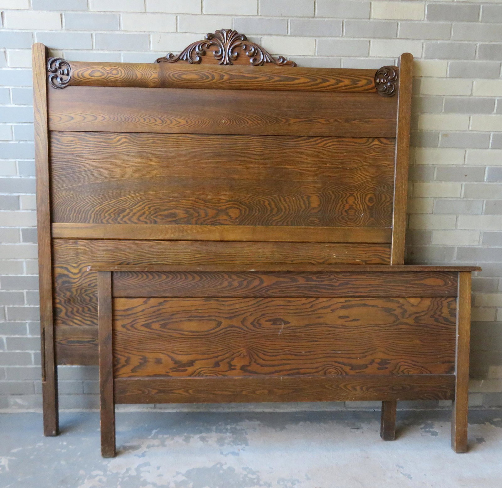 Golden oak bedstead with applied molding on crest. Very: Golden oak bedstead with applied molding on crest. Very good condition, original finish, early 20th century, 56"W x 63"H x 72"L (bed rails).