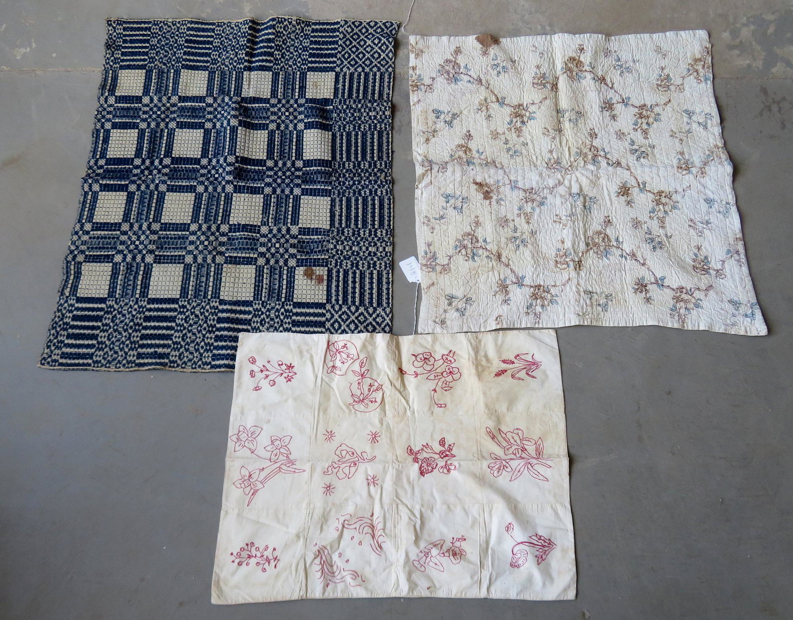 Three early crib quilts/coverlet, all 19th century and: Three early crib quilts/coverlet, all 19th century and with staining - fair condition. 35" x 43 1/2".