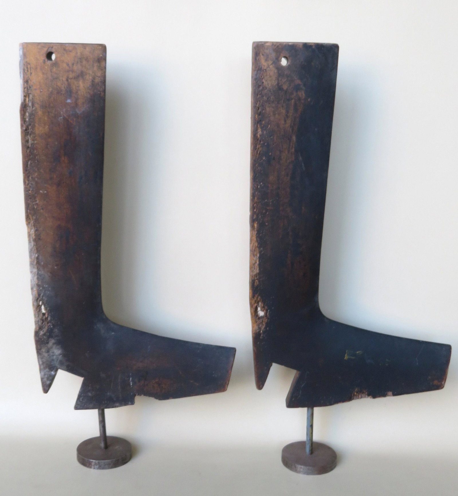 A pair of carved wooden cobbler's boot forms, 18th/19th: A pair of carved wooden cobbler's boot forms, 18th/19th century. Adding to the charm of these boots is the wear around the edge which shows extensive use of the forms in the making of boots by the cob