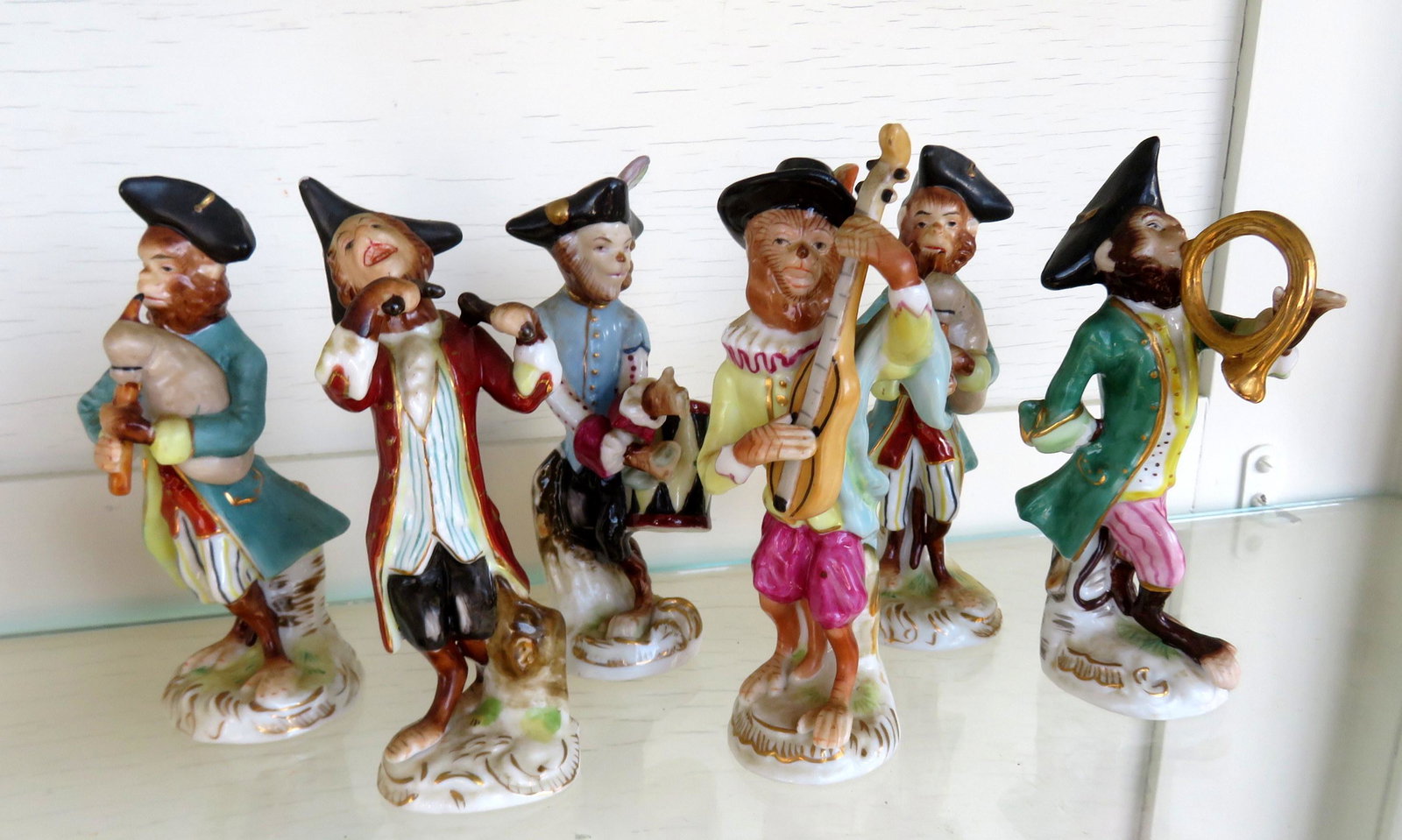 A set of 6 porcelain monkey band figurines, 2 with blue: A set of 6 porcelain monkey band figurines, 2 with blue hallmarks on base, others unmarked. All in very good condition, no damage. Each approximately 4 1/2"H.