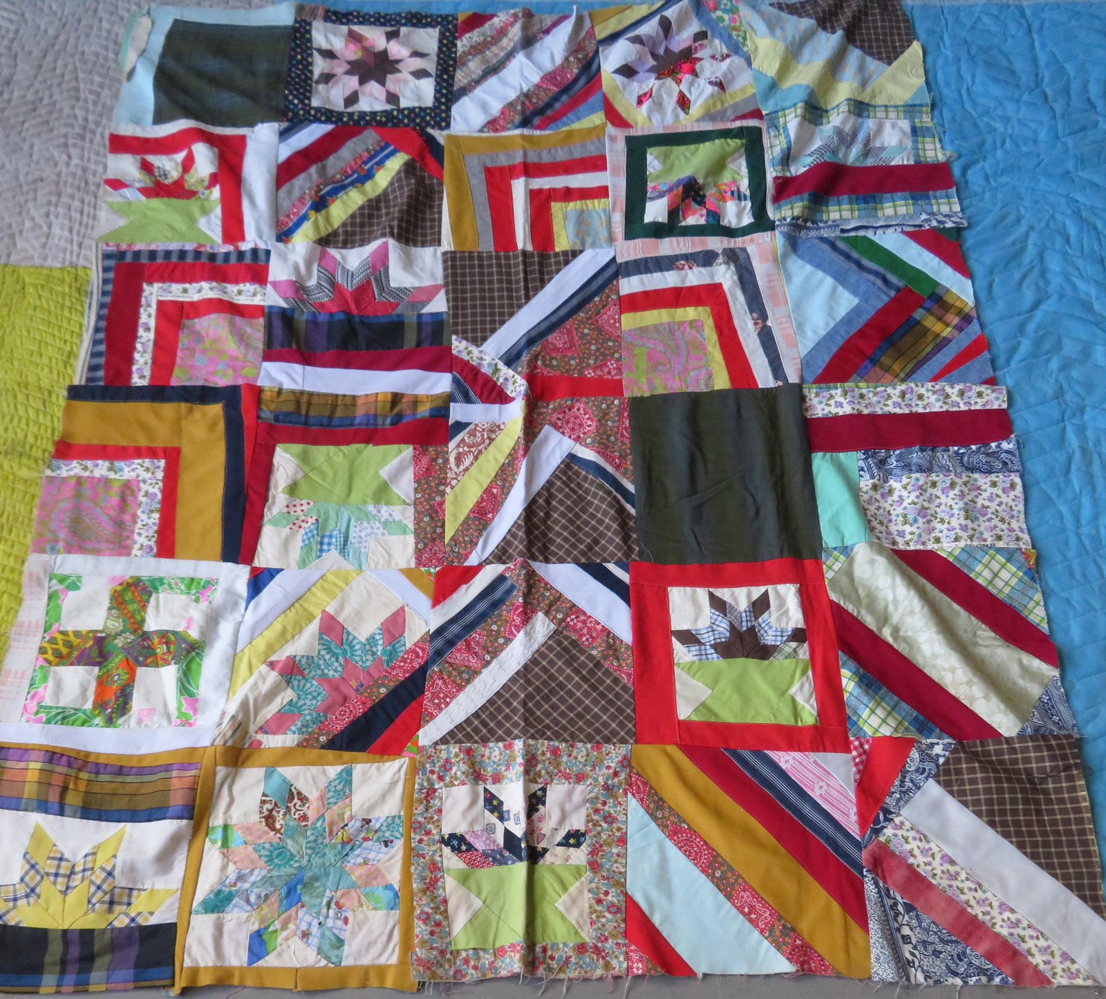 Sampler pattern patchwork quilt, circa 50, machine: Sampler pattern patchwork quilt, circa 50, machine sewn, has backing but unfinished border otherwise very good condition - 63" x 75".