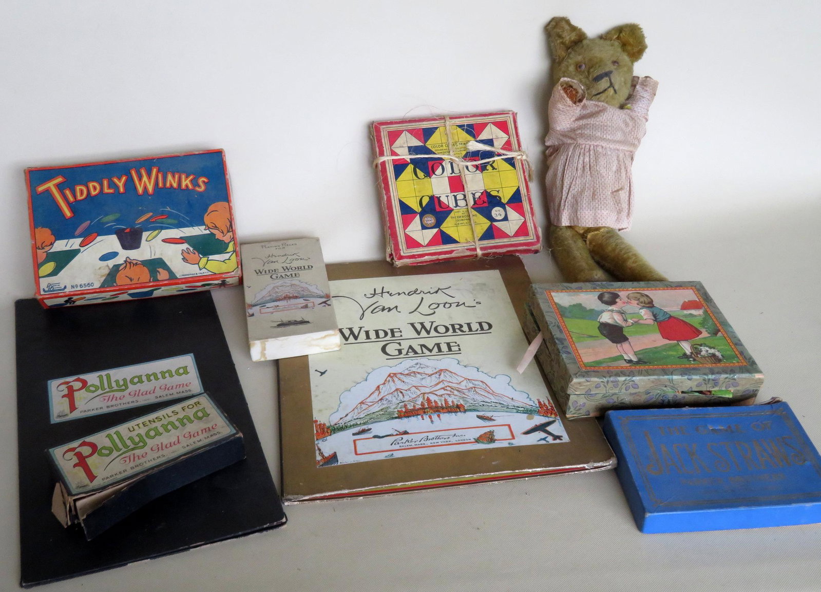 Group lot of kid's toys, games, Teddy bear, and a block: Group lot of kid's toys, games, Teddy bear, and a block puzzle. Games include: Pollyanna board game by Parker Bros. (some missing parts), Hendrik Van Loon's Wide World Game by Parker Brothers 1933 - a