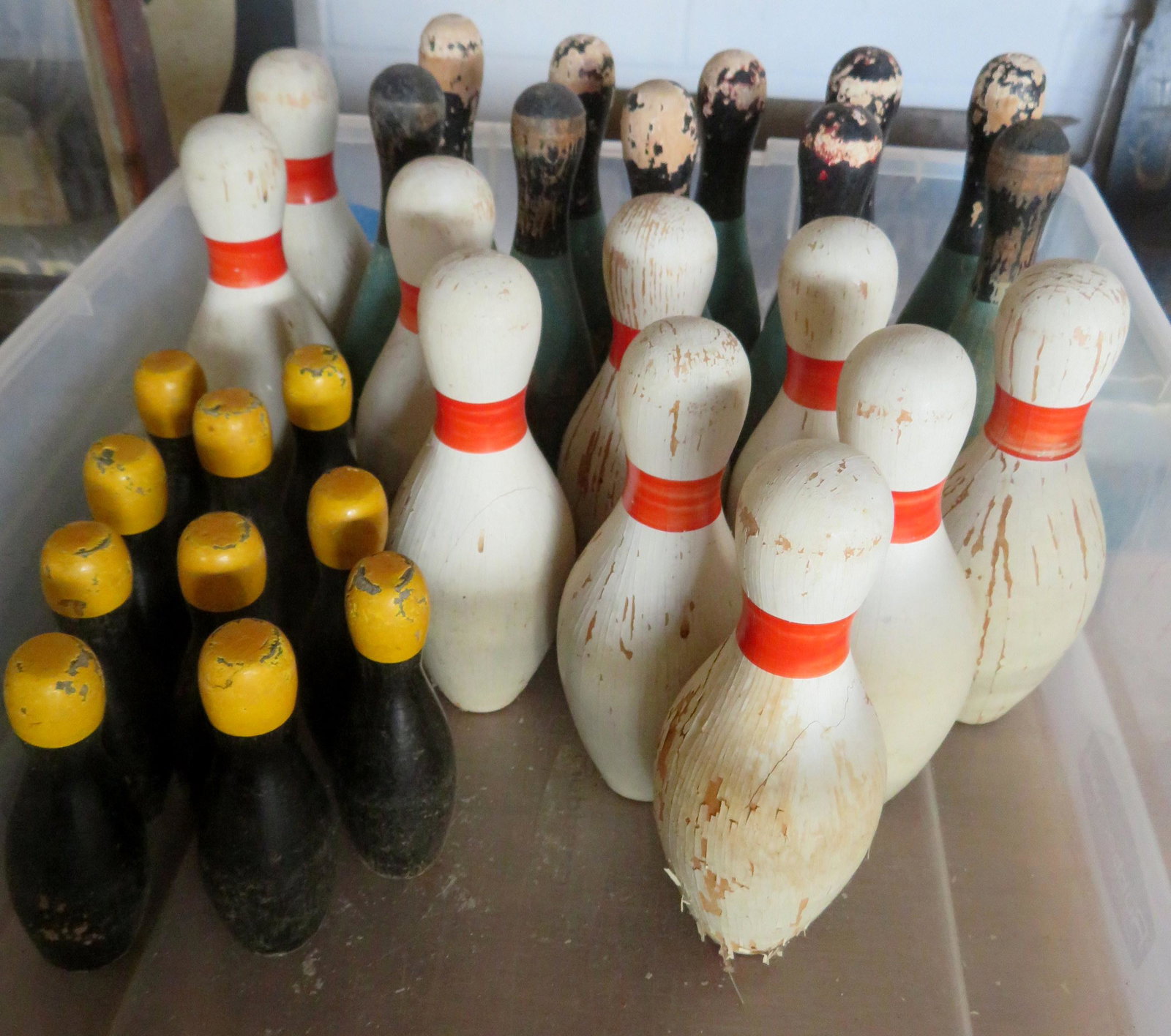 Grouping of 3 sets of 10 parlor bowling pins in: Grouping of 3 sets of 10 parlor bowling pins in original paint. Sizes - 5"H, 7 3/4"H, and 7 5/8"H. Some losses of paint, but most in good condition. Early to mid 20th century.