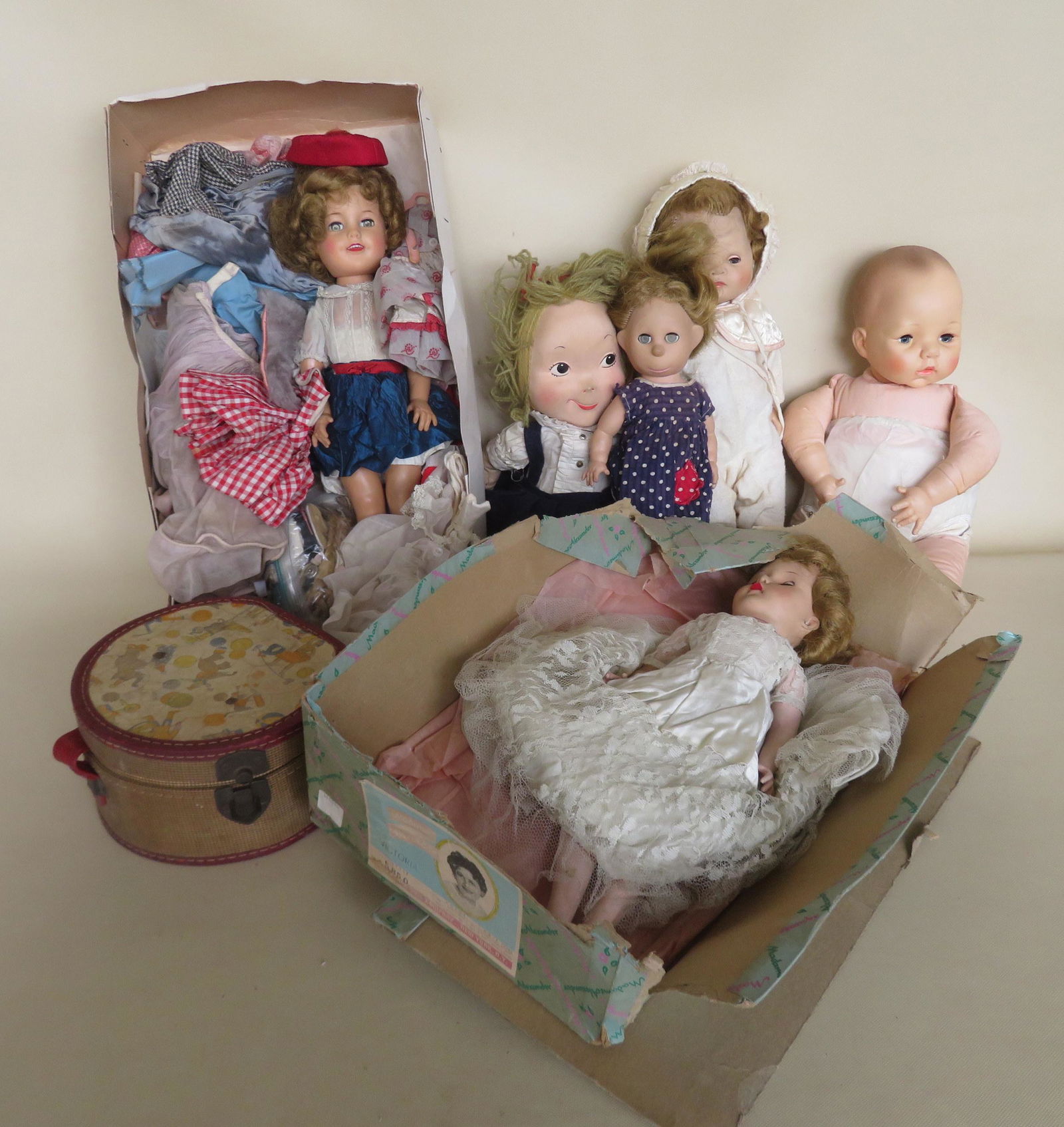 Grouping of vintage dolls including: Signed Alexander: Grouping of vintage dolls including: Signed Alexander 1966 rubber & cloth baby doll with crier; Ideal Shirley Temple doll signed "Ideal Doll" - vinyl body and rubber head; Vinyl doll wearing wedding g