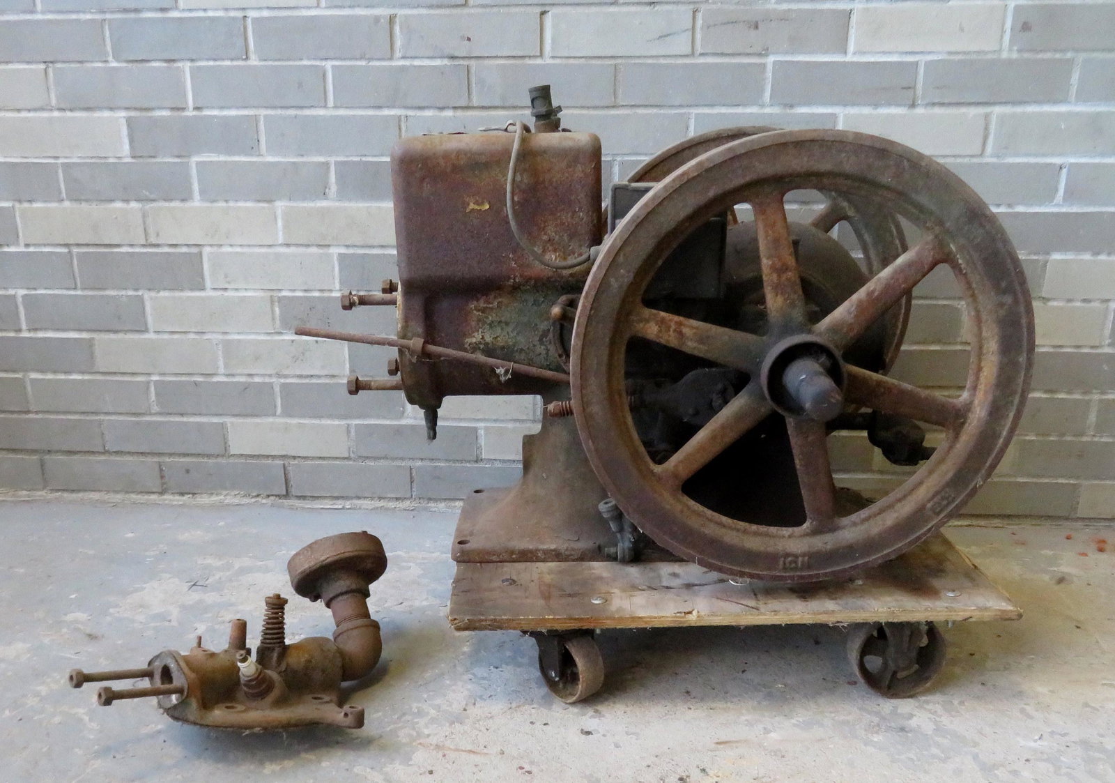 McCormick Deering, Model M engine - 1 1/2 HP. 32"L x: McCormick Deering, Model M engine - 1 1/2 HP. 32"L x 26"W x 21"H. Note, all engines are sold as-is, non-working, possibly missing parts, some with surface rust, some with traces of original paint, som
