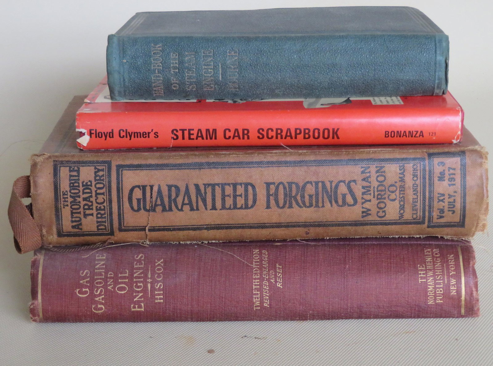 Grouping of 4 books related to cars and steam engines,: Grouping of 4 books related to cars and steam engines, including Handbook of the Steam-Engine - 1873; Floyd Clymer's Steam Car Scrapbook 1945; Gas, Gasoline and Oil Vapor Engines 1904; and The Automob
