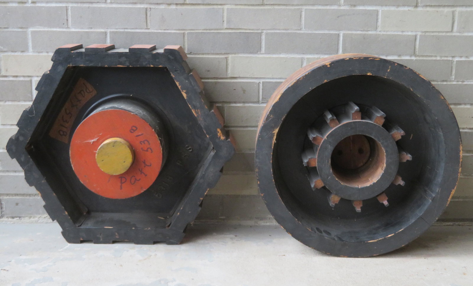 Two industrial wooden foundry molds: Two industrial wooden foundry molds in the form of wheels - round 20"D x 7 1/4"w and hexagonal 24"D x 7"W - Very good condition.