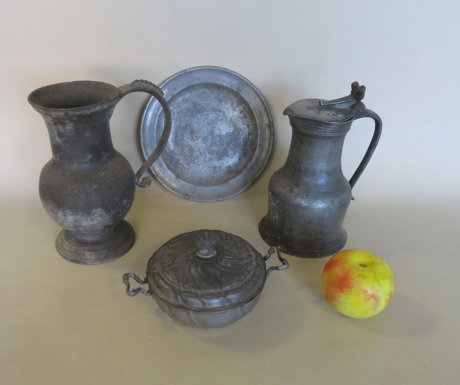 Four pieces of early pewter including: Tankard with (1 of 10)