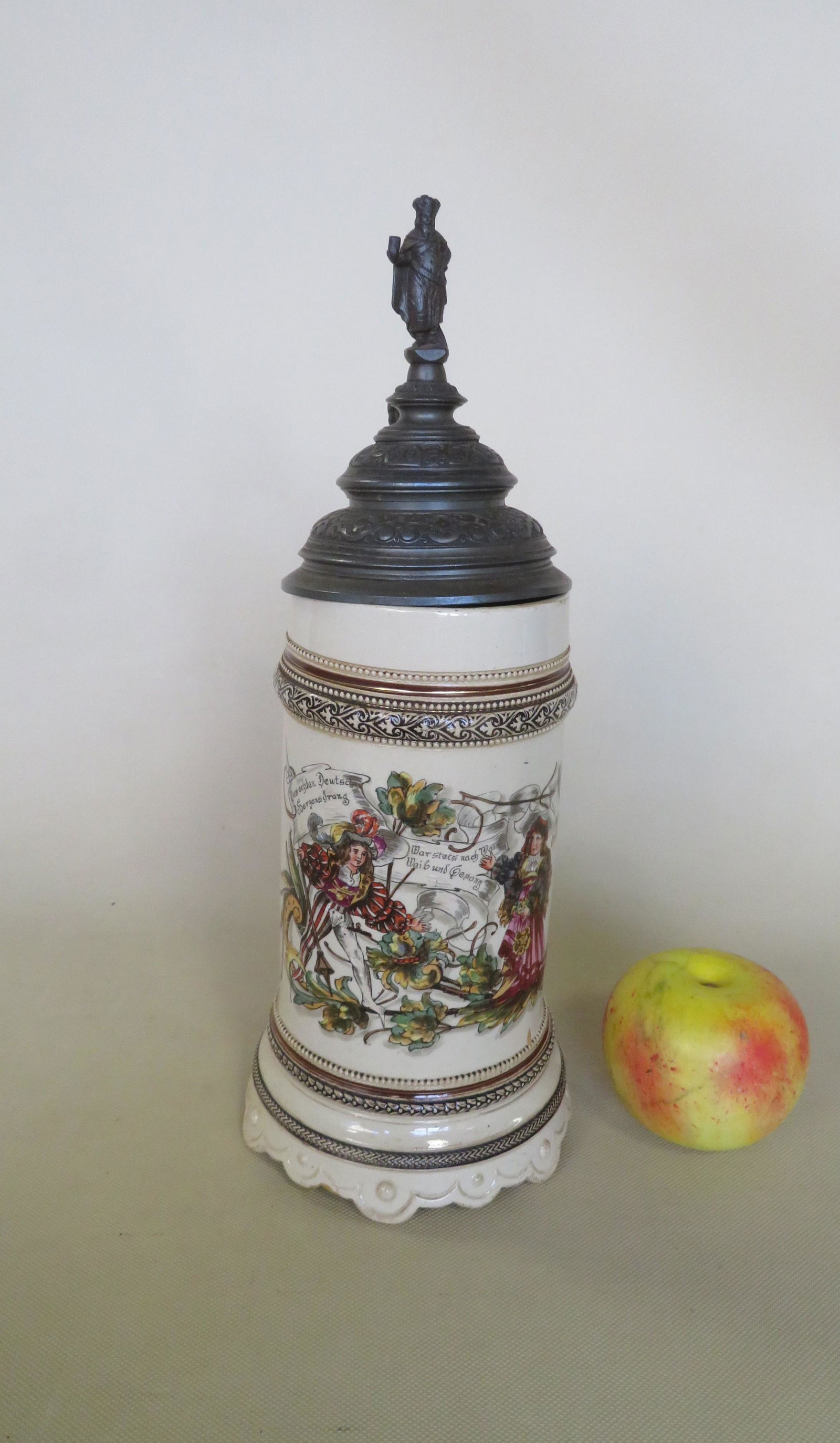 A hand painted German stein with figural pewter lid. (1 of 10)