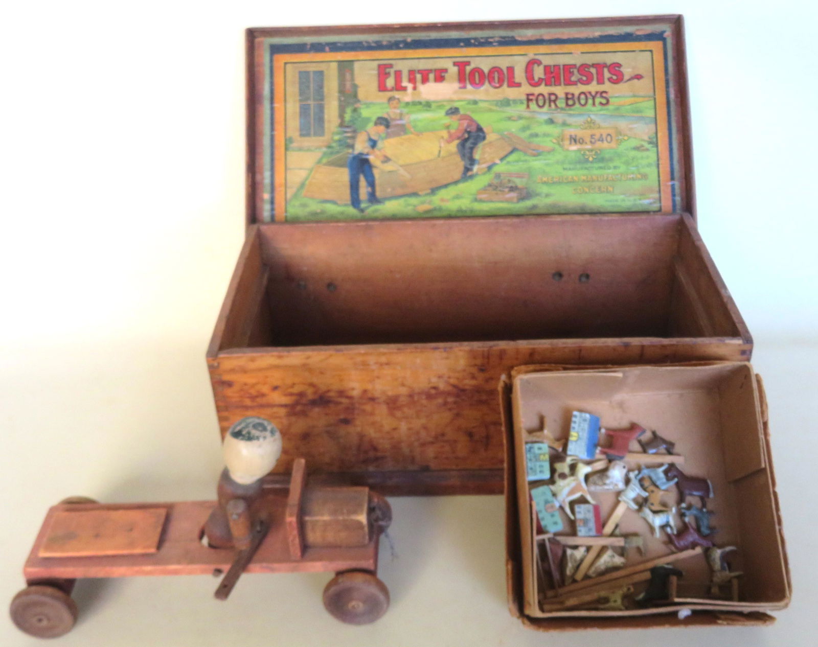 Grouping of toys including: Tool box with lithograph (1 of 5)