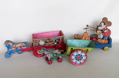 Three vintage wooden pull toys including: "Fisher Price: Three vintage wooden pull toys including: "Fisher Price Toys / Mickey Mouse Band" - losses to paper lithograph, otherwise good working condition - 12 1/8"L; "The N.N. Hill Brass Co." wooden horse draw