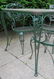 Glass top wrought iron patio table with 4 matching - 3