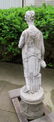 A cast stone garden sculpture/fountain, that depicts a - 8