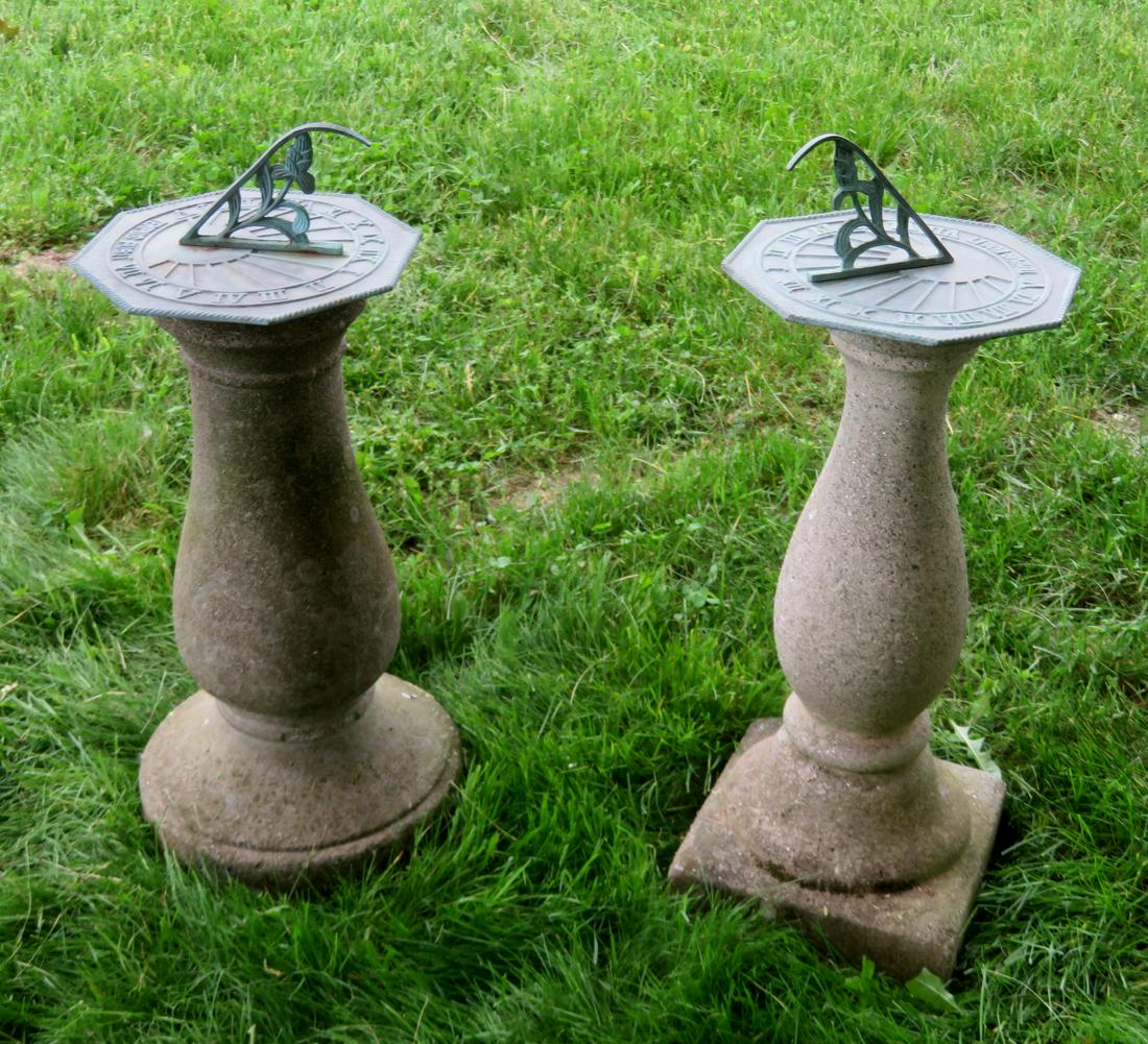 Two octagonal shaped zinc sundials mounted on: Two octagonal shaped zinc sundials mounted on non-matching concrete bases. Each sundial having a floral shaped gnomon and Roman numeral dial - 10"dia. x 4"H - both in very good condition - 20th centur