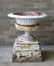 A Victorian cast iron garden urn in 5 original