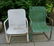 A pair of woven wicker chairs on sheet iron rocking