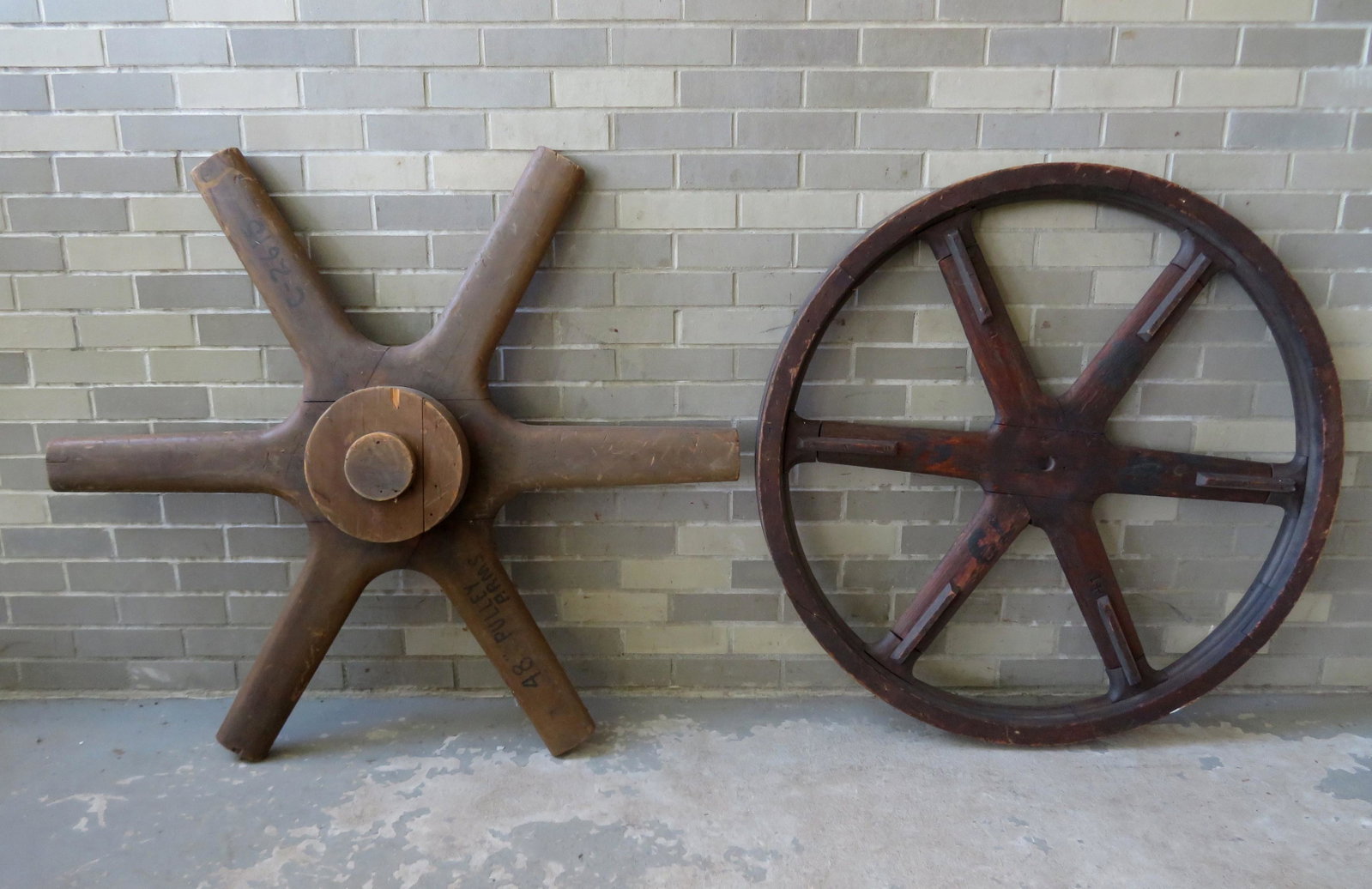 Two large wooden wheel shaped industrial molds, 47"Dia.: Two large wooden wheel shaped industrial molds, 47"Dia. X 6 1/2" thick and 39 3/4"D x 3 1/4" thick.. Both in good condition.