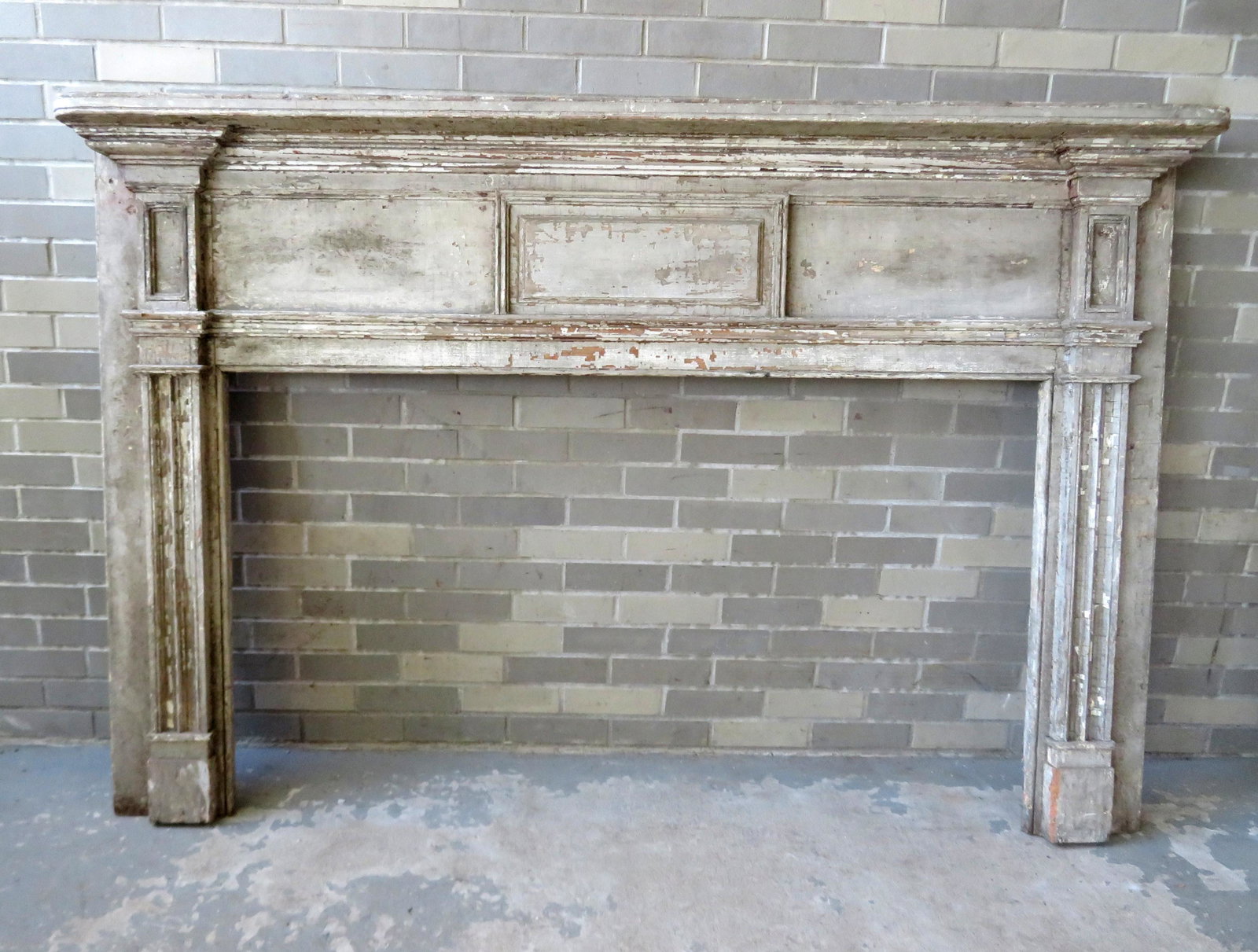 A federal fireplace mantel with architectural molding,: A federal fireplace mantel with architectural molding, early 19th century. 75 5/8"W x 8"D x 51"H - the opening 58 1/2"W x 33"H. Layers of old paint and in very good condition.