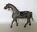 A folk art carved and painted horse with horse hair