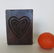 An early mahogany carved cookie mold in the shape of a