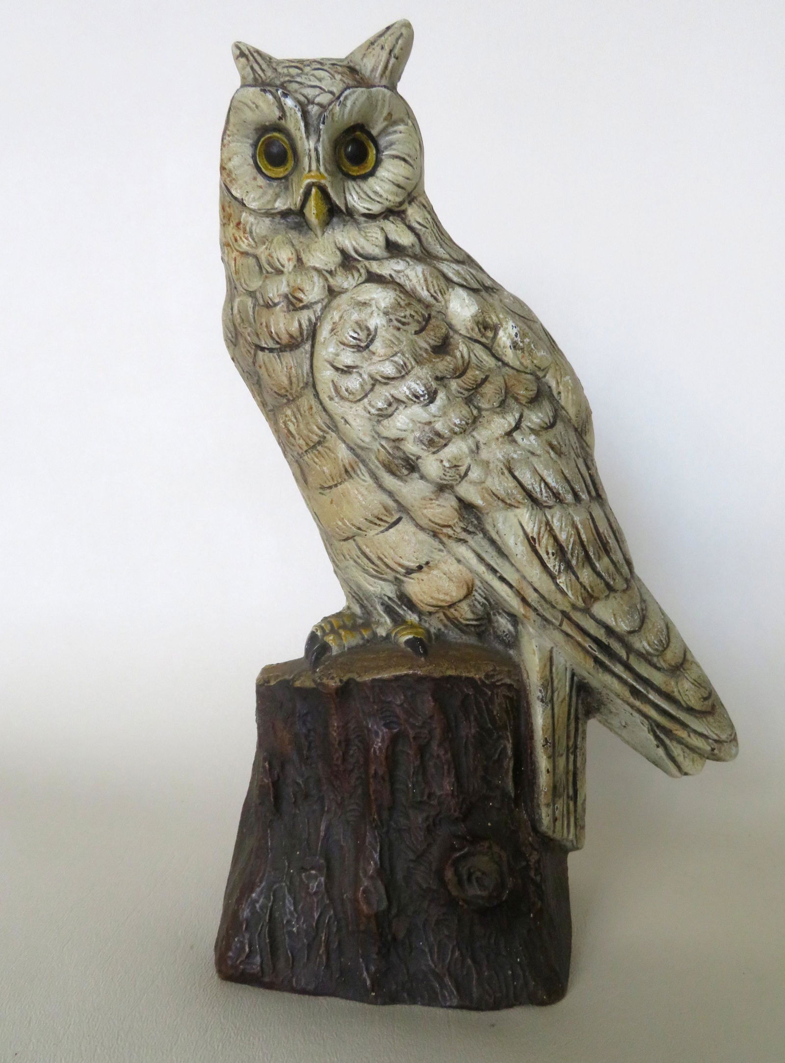 Cast iron door stop, Judd Mfg. Co., in the form of a: Cast iron door stop, Judd Mfg. Co., in the form of a Snowy Owl standing on stump, original paint, marked "cjo 1287" on reverse, early 20th century. Very good condition. Size 10 1/4"H.