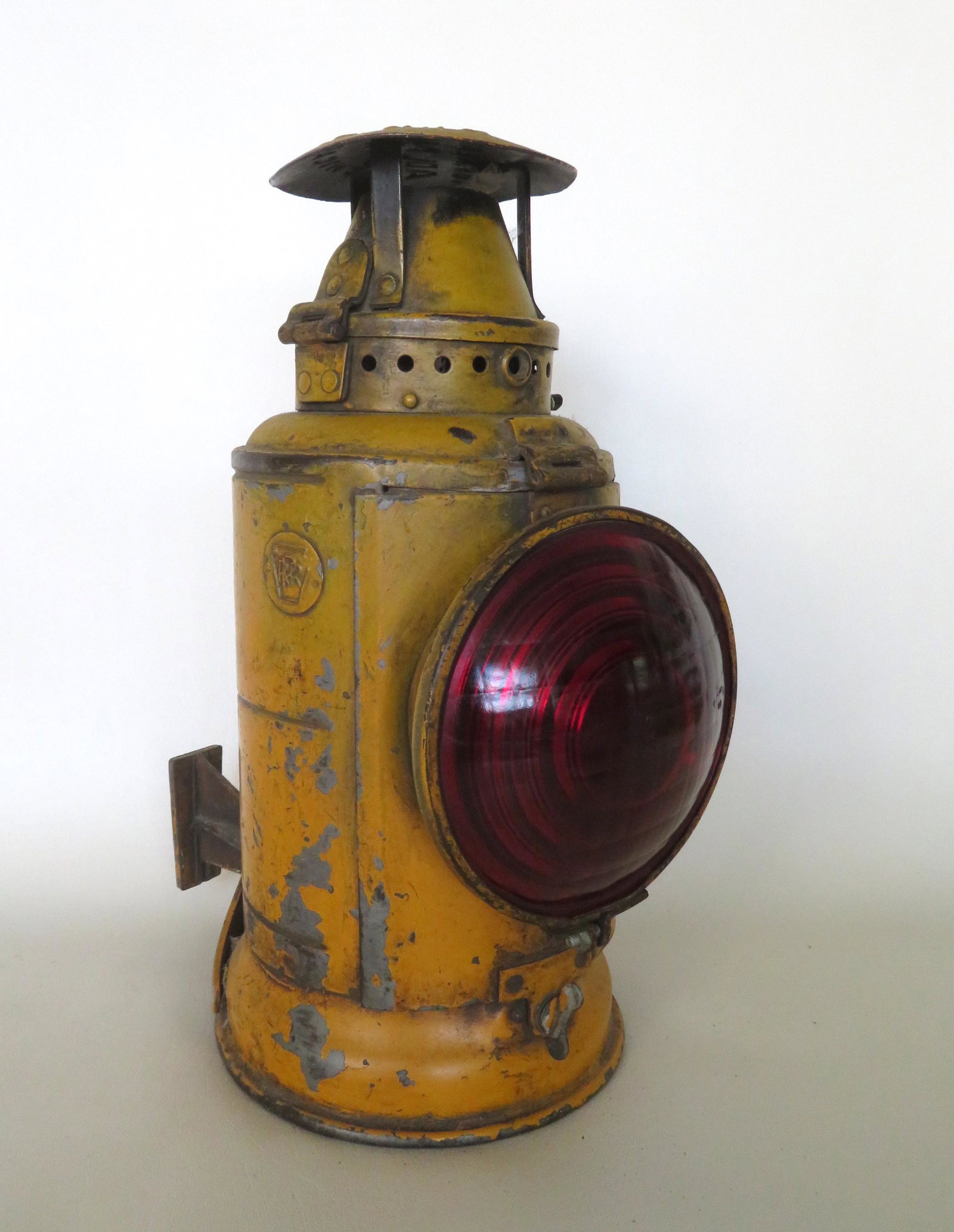 Pennsylvania Railroad single lens lantern with PRR: Pennsylvania Railroad single lens lantern with PRR embossed mark on side and the top signed "The Non-Sweating Adlake Lamp Chicago". Comes with original adjusting mounting bracket and appears to retain
