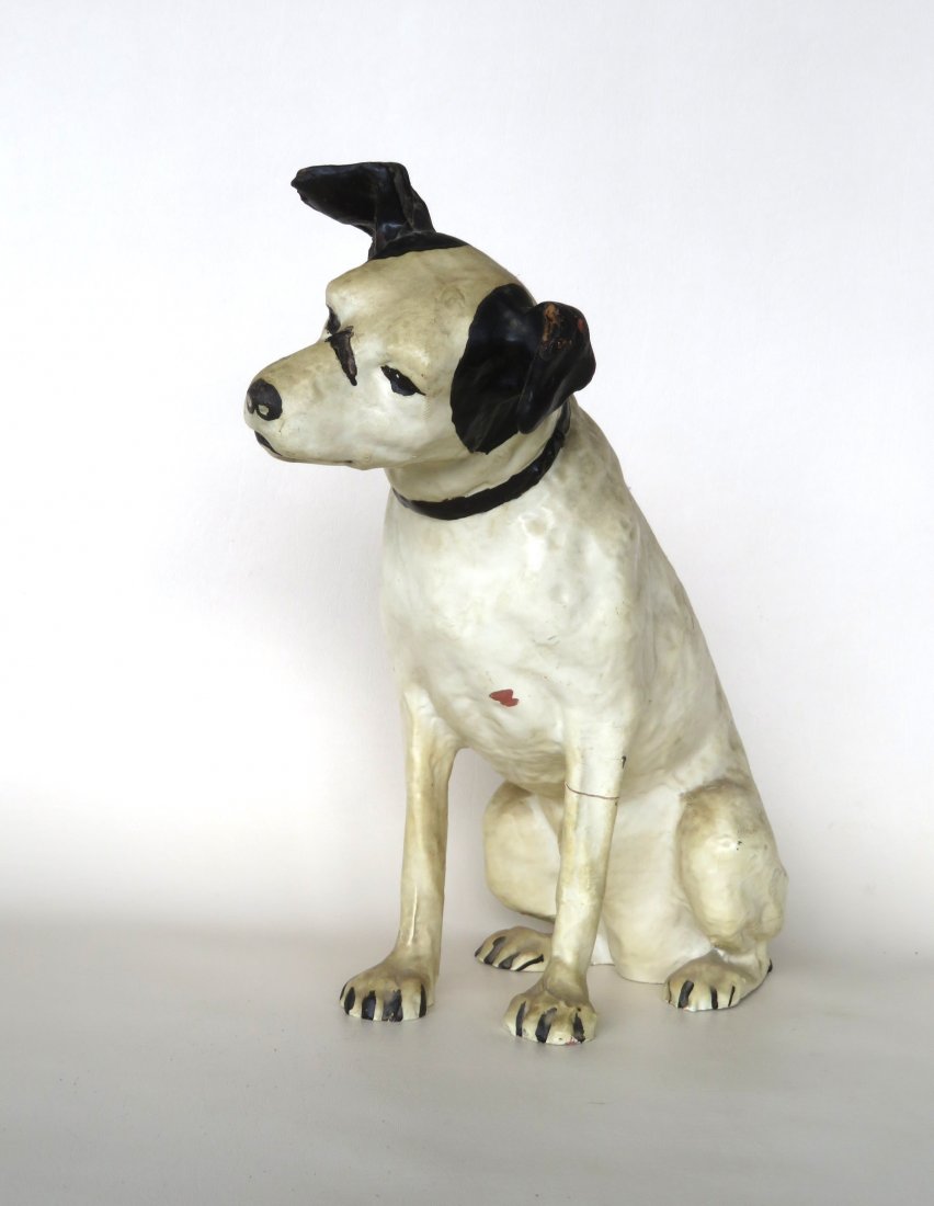 A "Nipper" paper mache dog, used for advertising RCA: A "Nipper" paper mache dog, used for advertising RCA products, early to mid 20th century, and appears to retain original black and white paint. 14"H x 9 1/4"D. Provenance: From a retired local physici