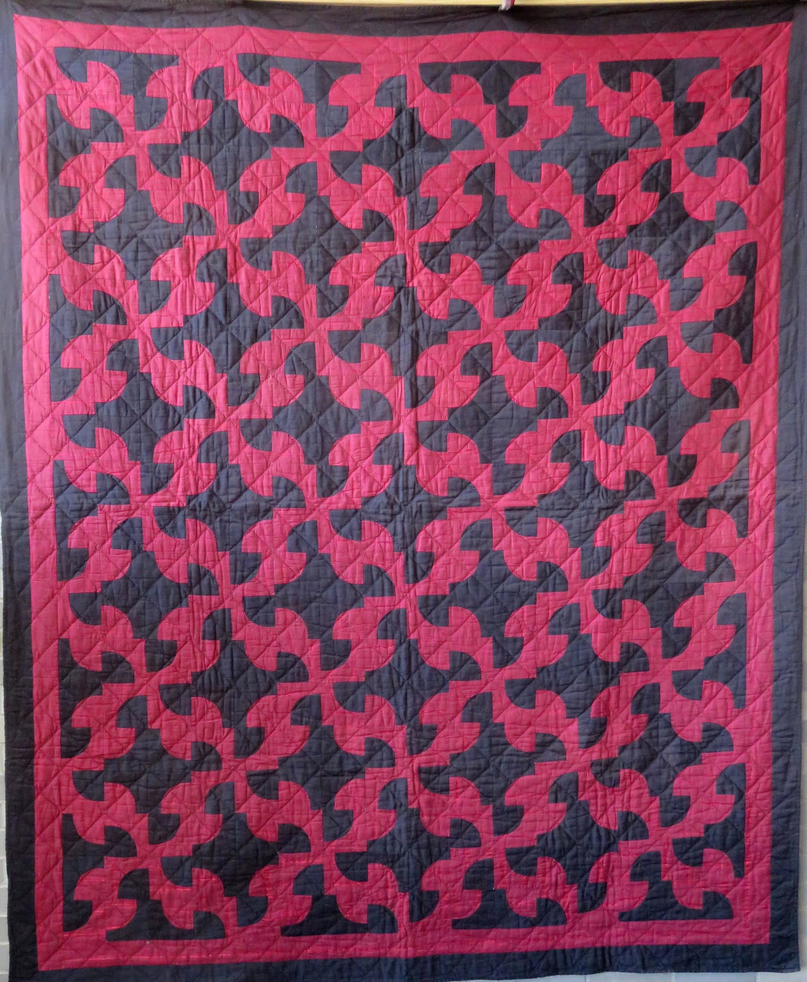 Amish patchwork quilt with red and black patches, a: Amish patchwork quilt with red and black patches, a solid black border, and a gray wool backing, late 19th century. Some fraying of red material, but overall good condition. Hand sewn pattern and quil
