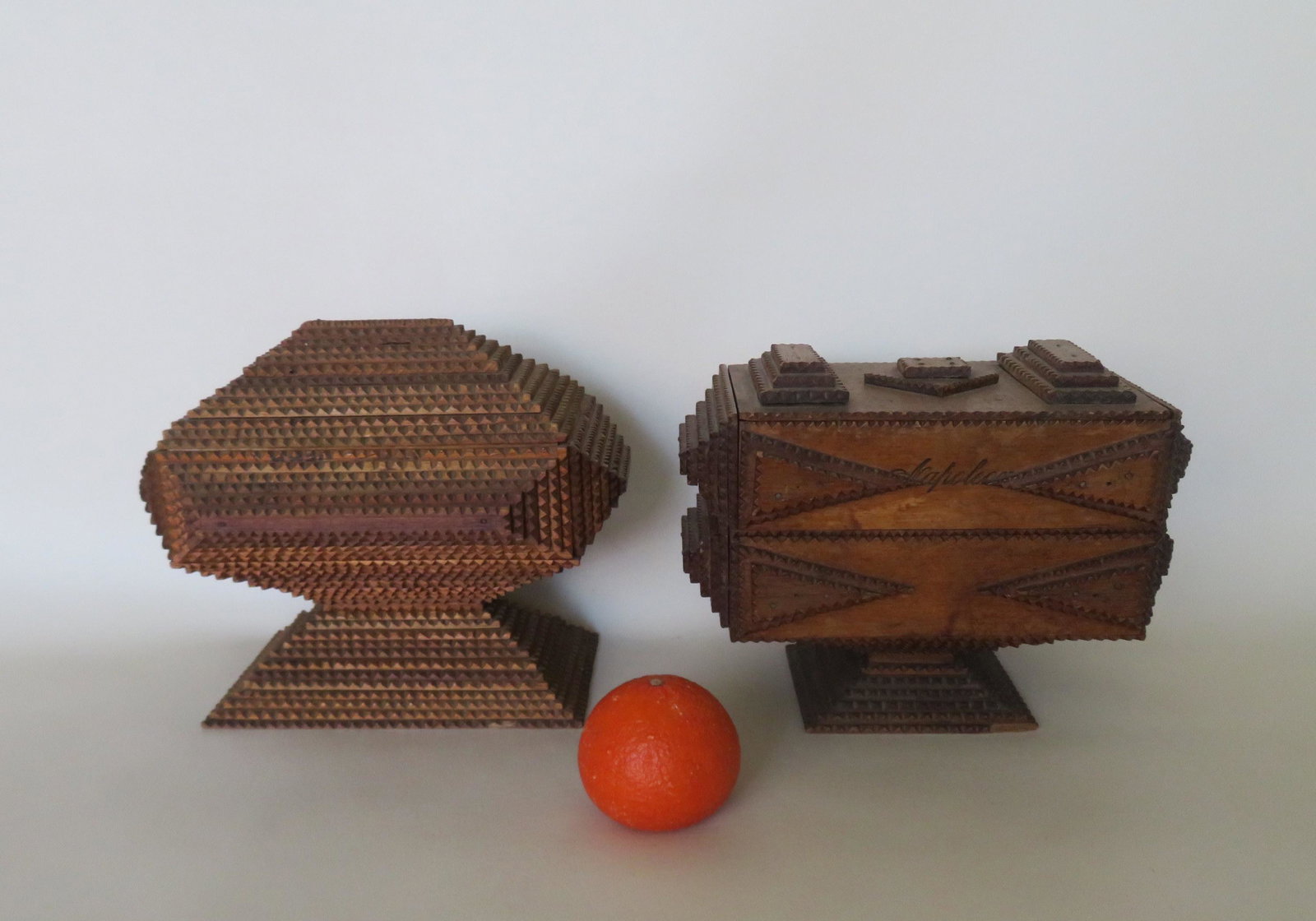 Two tramp art footed boxes, late 19th century. The: Two tramp art footed boxes, late 19th century. The first, with lift top and lower drawer - 7 3/4"H x 10 1/4"W x 6"D - small wood chip on edge of top corner, else very good condition; and the second wi