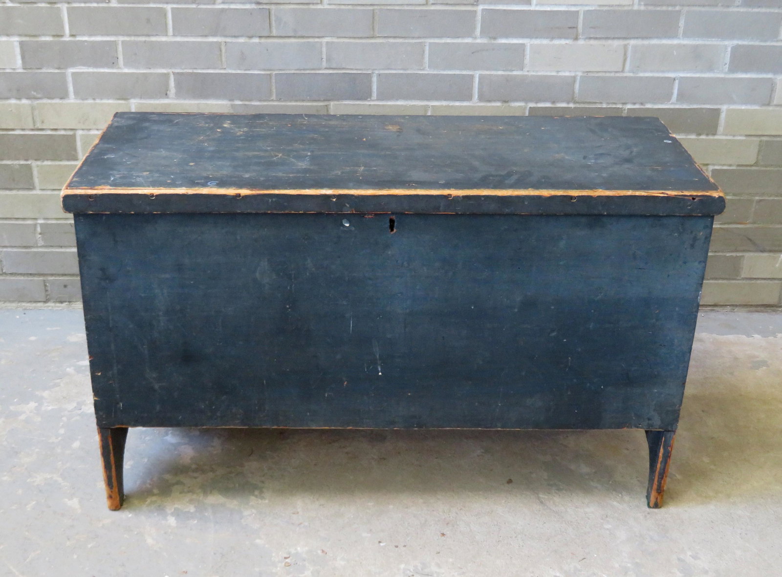 A good blanket box in original blue paint with unusual: A good blanket box in original blue paint with unusual cutouts on sides and also having a secret interior drawer below till, early to mid 19th century. Some use wear to paint, particularly around the 