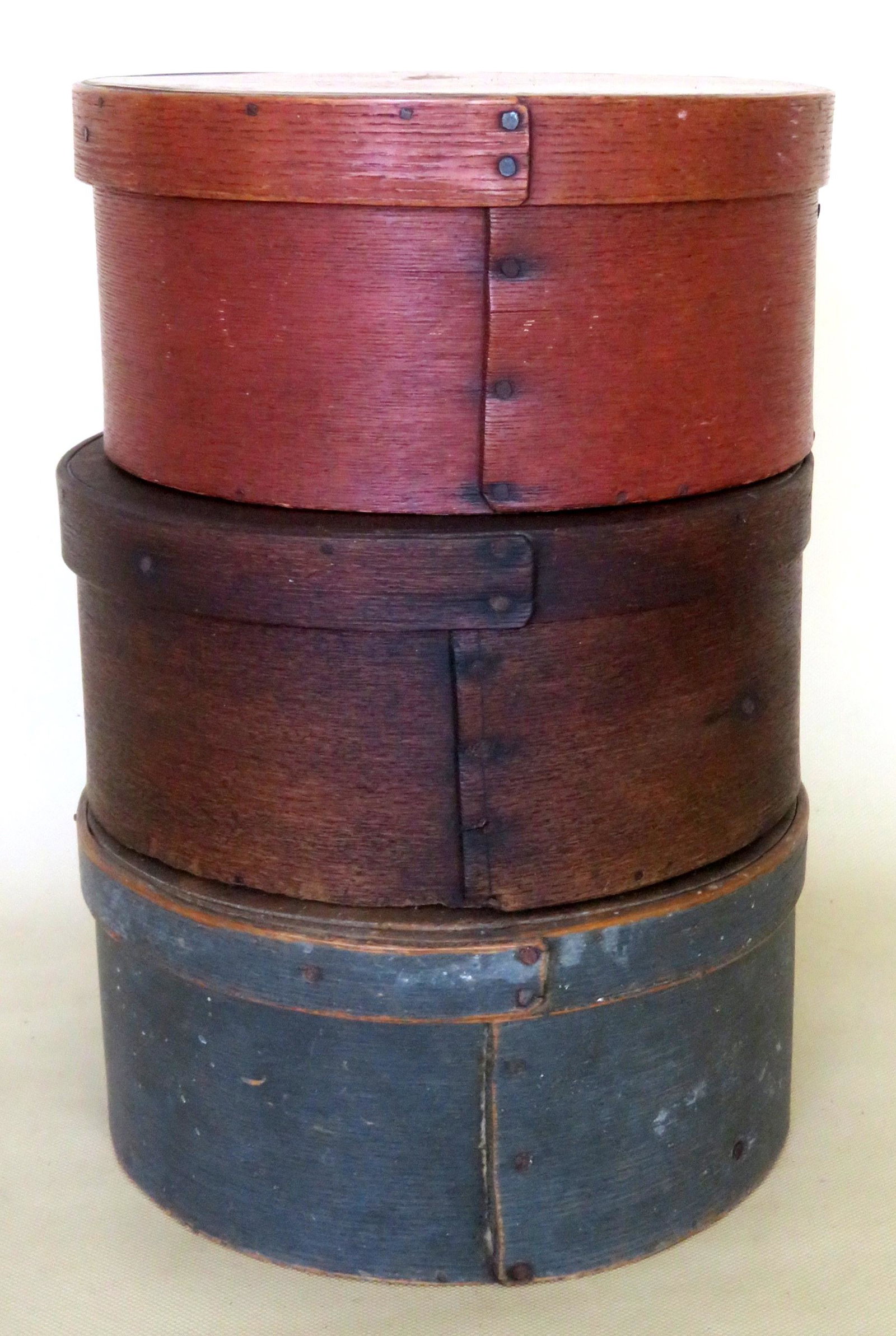 Three pantry boxes including: The first in original: Three pantry boxes including: The first in original blue-green paint - 9"D x 4 1/4"H - use wear consistent with age and overall good condition; the second, in original red stain - 8 5/8"D x 4 1/4"H, -
