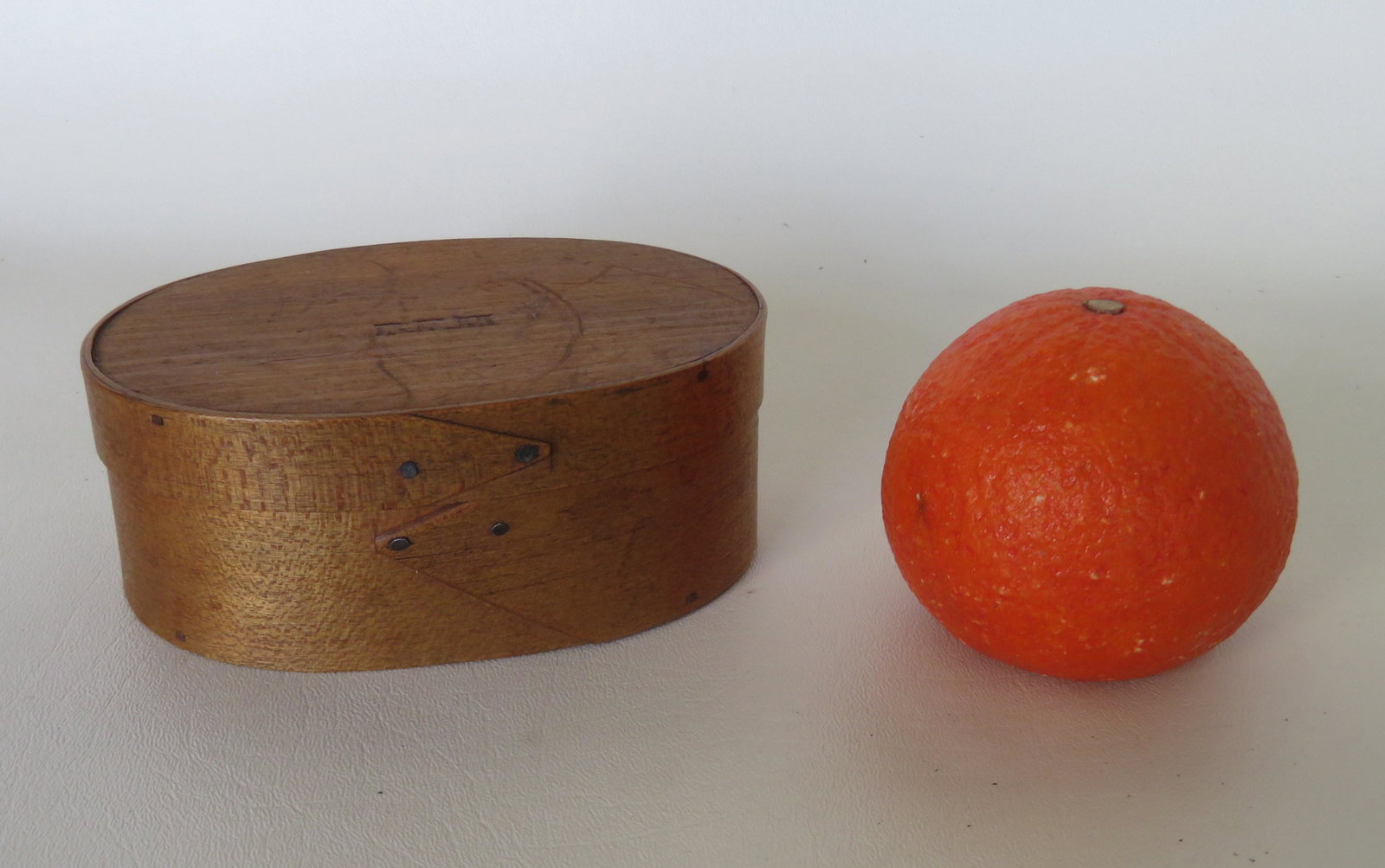 Bella F. Hersey oval pantry box, Hingham Mass., stamped: Bella F. Hersey oval pantry box, Hingham Mass., stamped on lid BFH. The back side with a horizontal hairline, otherwise good condition in natural finish. 5 1/4"W x 3 3/4"D x 2"H.
