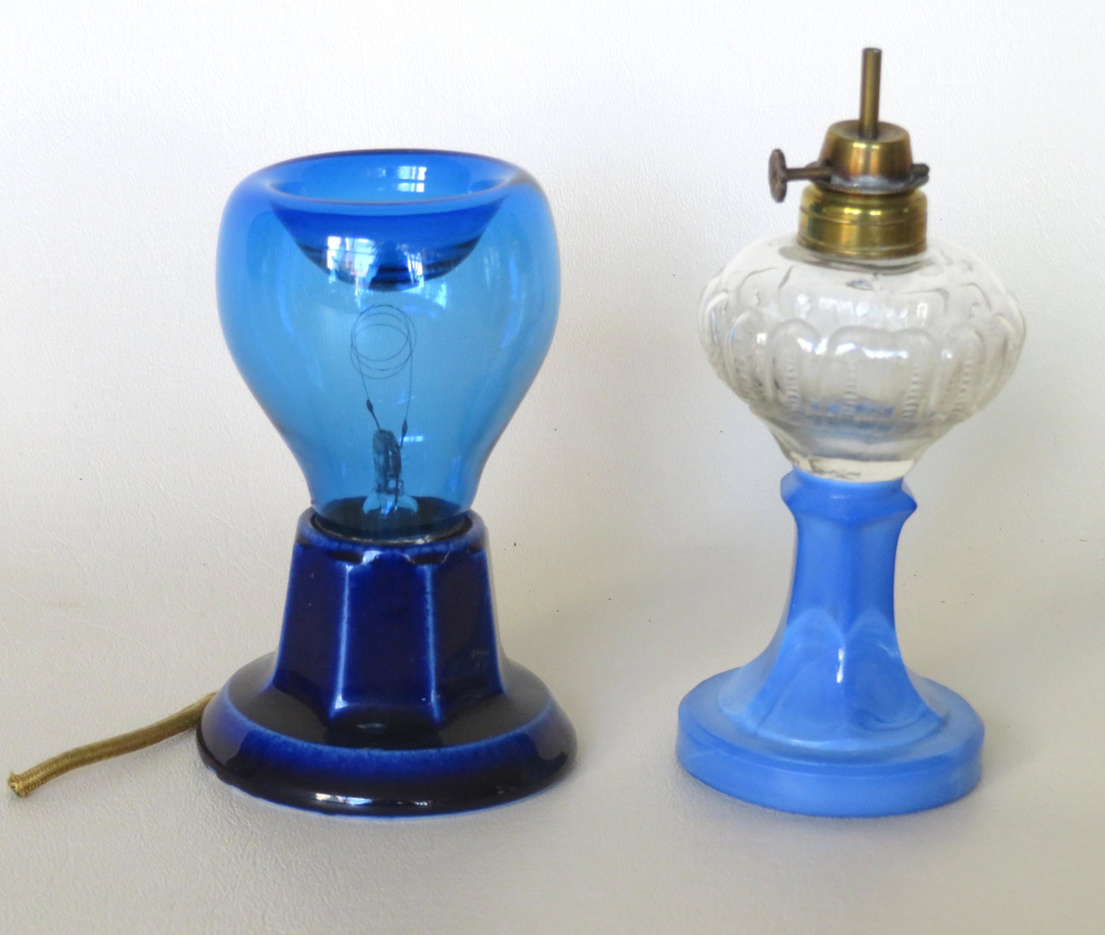 Two unusual glass lighting devices including: The first: Two unusual glass lighting devices including: The first a miniature lamp having an opaque blue slag glass pedestal base below a colorless ribbed 2 mold blown fluid lamp marked on collar "Pat'd Apr. 13