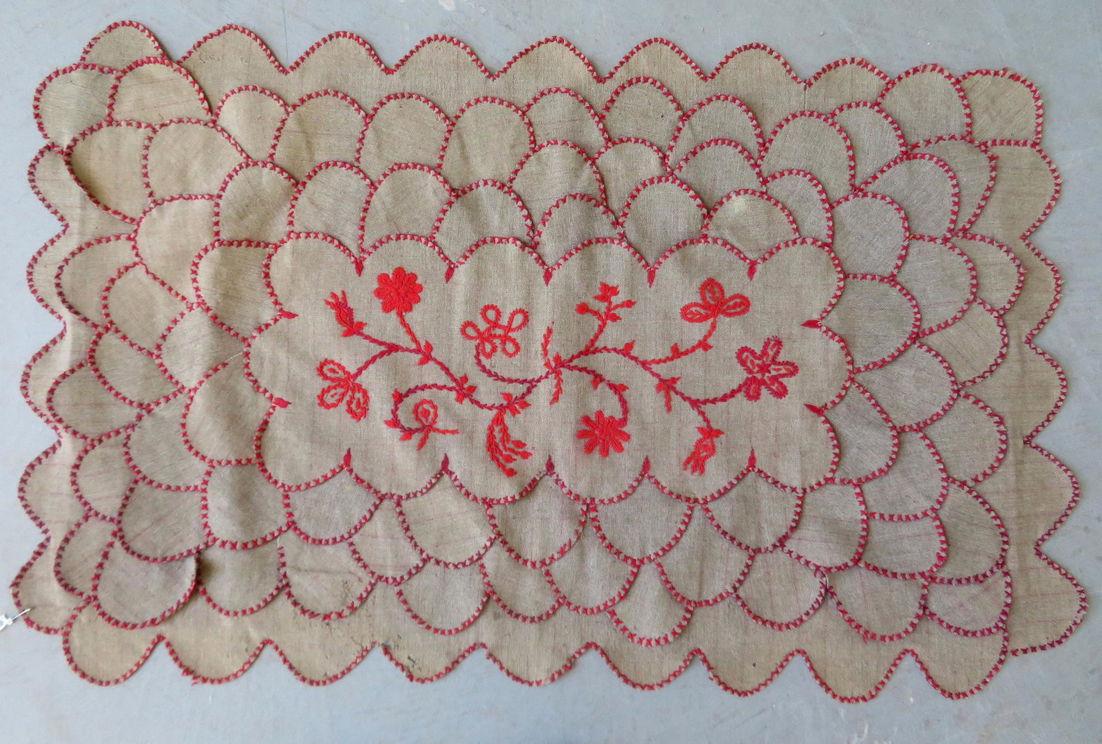 A wool table penny rug with embroidered sprig of: A wool table penny rug with embroidered sprig of flowers in the center, 19th century. 39" x 24". Minor moth damage, and overall good condition. Provenance: From a private Hudson Valley owner's lifetim