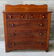 A mahogany and pine Empire chest having 2 short drawers