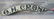 Vintage curved wooden store sign marked "O. H. CRONK" -