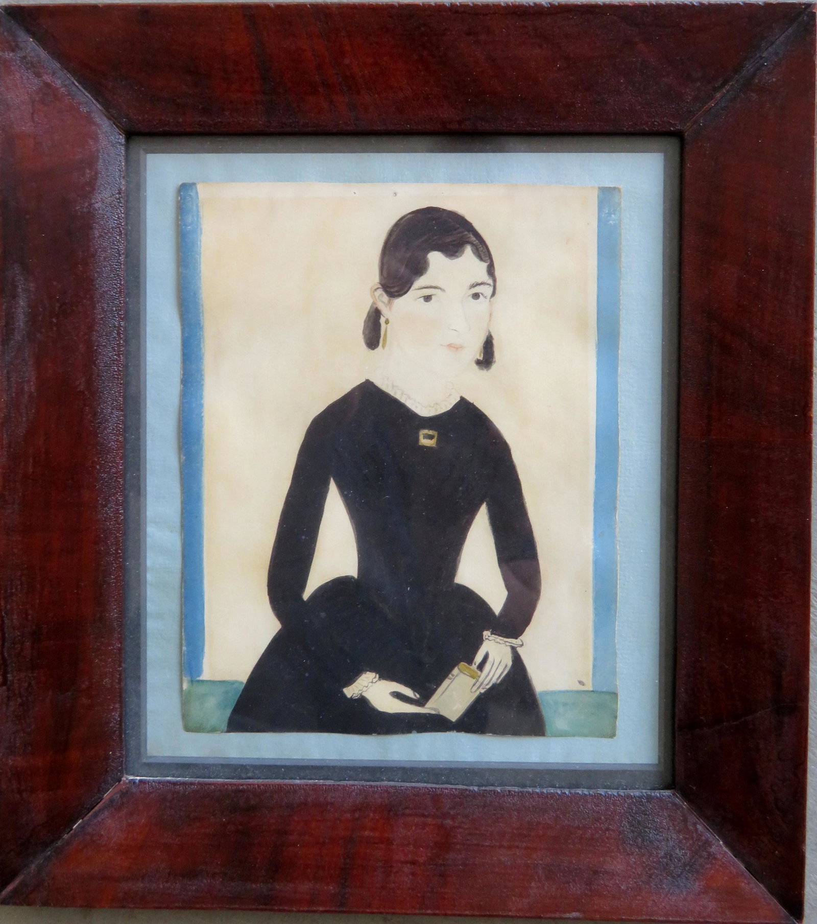 Naive portrait of young woman wearing gold earrings: Naive portrait of young woman wearing gold earrings and broach, holding a book, attributed to J.A. Davis (Jane Anthony Davis, active CT & RI, 1821 - 1855). Good conservatory work to preserve portrait 