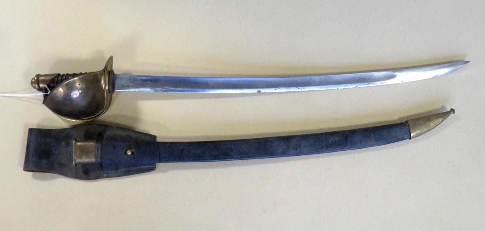 An Ames 1862 Naval Cutlass with scabbard and belt frog.: An Ames 1862 Naval Cutlass with scabbard and belt frog. Looks hardly used, and in very good condition. The sword marked "Ames Mfg Co / Chicopee Mass." and opposite side marked "USN / D.P. / 1862".