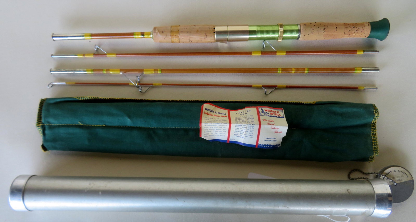 Two fishing poles including: A split bamboo fly rod: Two fishing poles including: A split bamboo fly rod signed "Anglers' Choice / Sewell N. Dunton & Son Inc. / Greenfield Mass." - 3 section with extra tip - each section 34 1/2"L - very good condition w