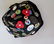 A wonderful 1930-40's child's felt beanie cap with many - 3