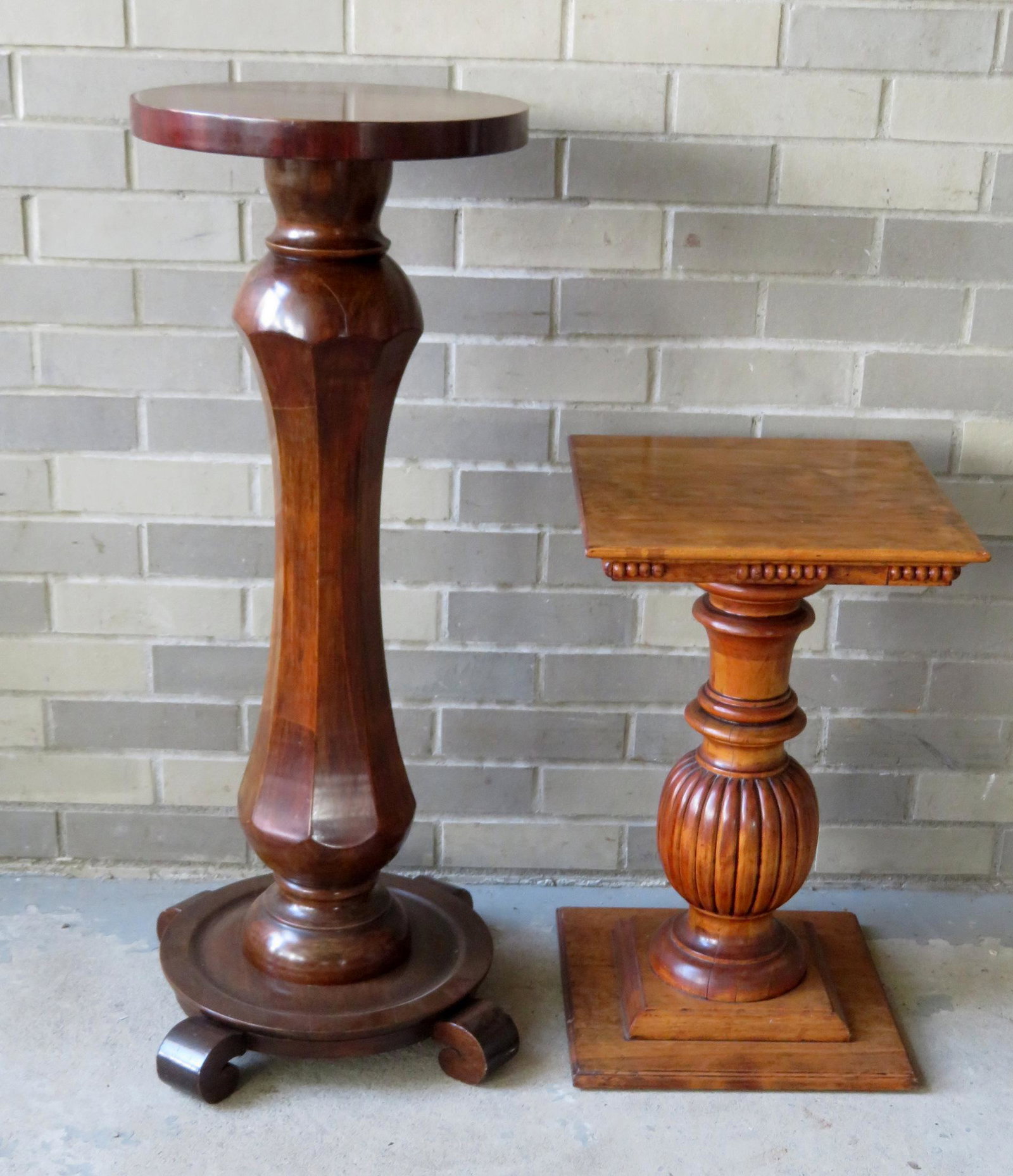 Two refinished wooden pedestals, late 19th to early: Two refinished wooden pedestals, late 19th to early 20th century. The larger in mahogany with an octagonal concave pedestal and 4 small scrolled feet extending from circular base - approximately 35"H 