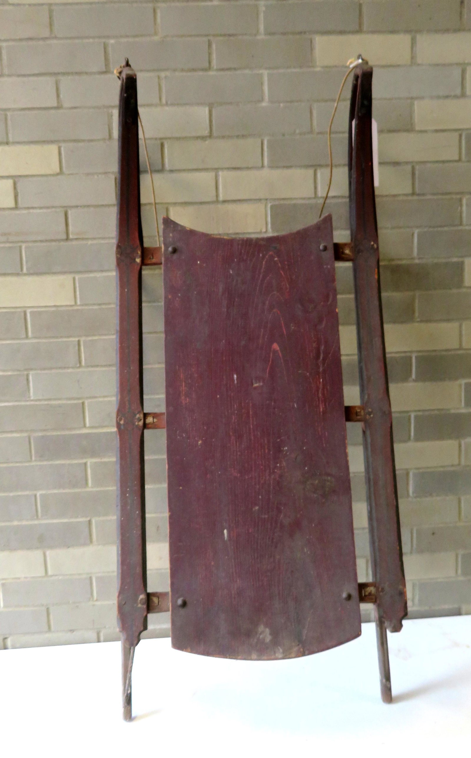 Child's sled in original red and black stenciling, wood: Child's sled in original red and black stenciling, wood and iron runners, 19th century, signed "Stone Forsythe / Boston Mass. / 2 Som No. 410". Very good condition. 45 1/4"L x 20 1/4"W x 16 3/4"H.