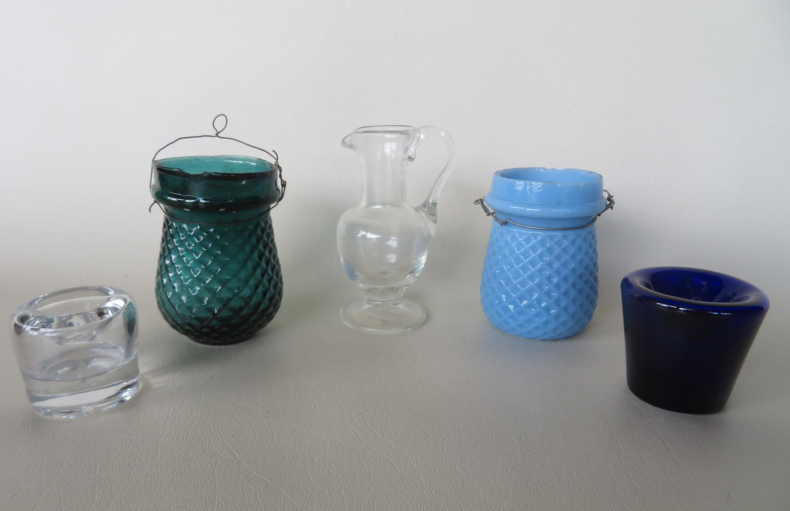 Five pieces of early glass including: 2 glass fairy: Five pieces of early glass including: 2 glass fairy lamps for Christmas lighting, one opaque blue the other transparent green, both with slight rim chips otherwise good condition, circa 1900 - each ap