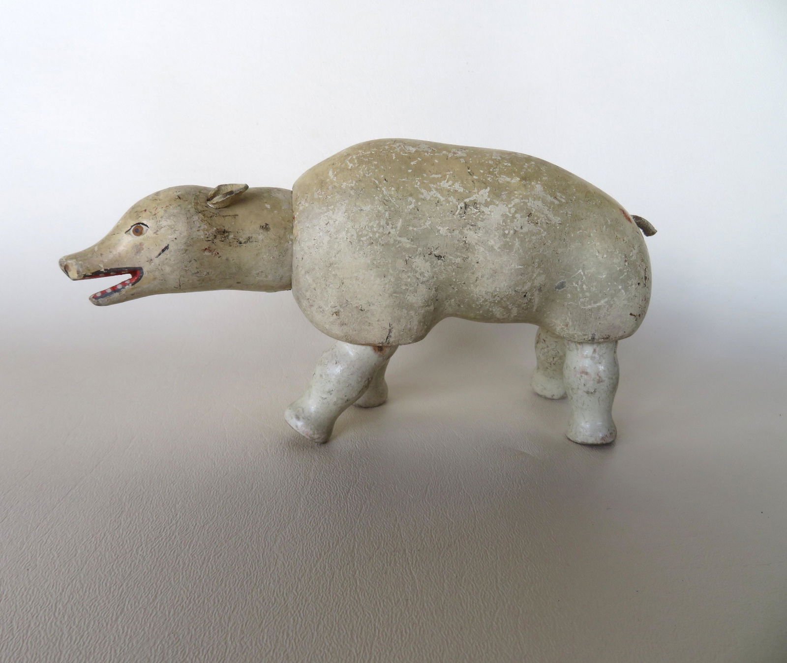 Schoenhut wooden articulated polar bear with open mouth: Schoenhut wooden articulated polar bear with open mouth and in original paint and with original leather ears, from the Schoenhut Circus, early 20th century. 8"L x 4 1/4"H. Minor use wear and in good o